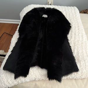 Black fur and suede winter vest. Worn one time. Size M.